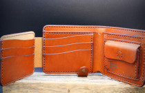 Ruda piniginė su užvartu